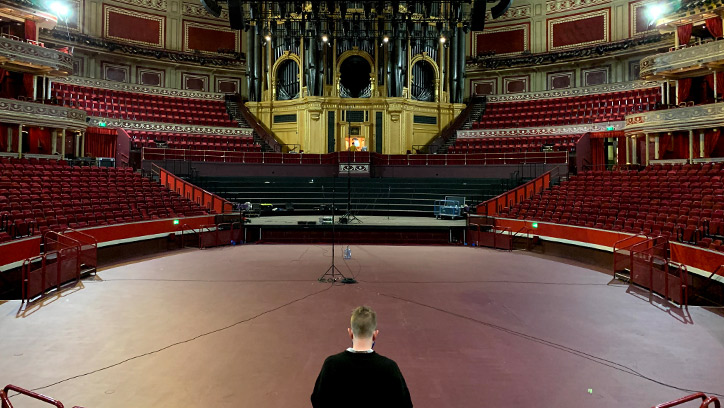 Man standing in front of an empty Royal Albert Hall, London