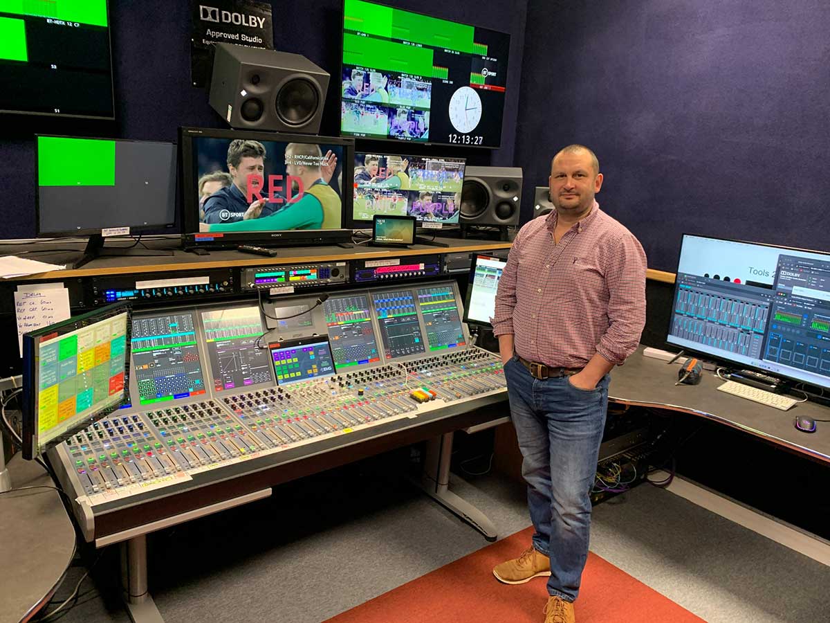 EMG UK's Simon Foster in front of the Calrec Artemis broadcast console