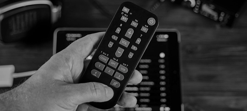 Hand holding the RME ADI-2 Series MRC remote control