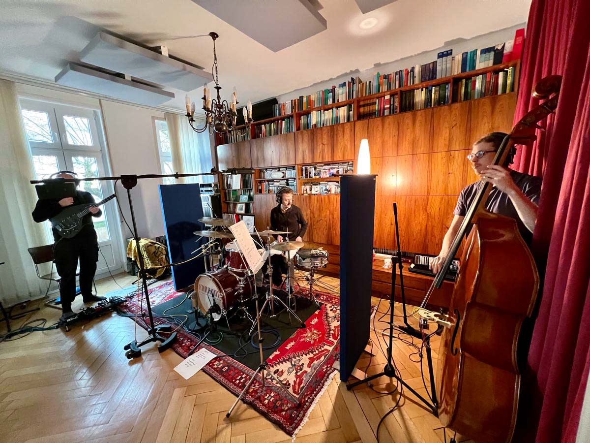 Three musicians recording in the Electronic Memory Studio, Frankfurt.