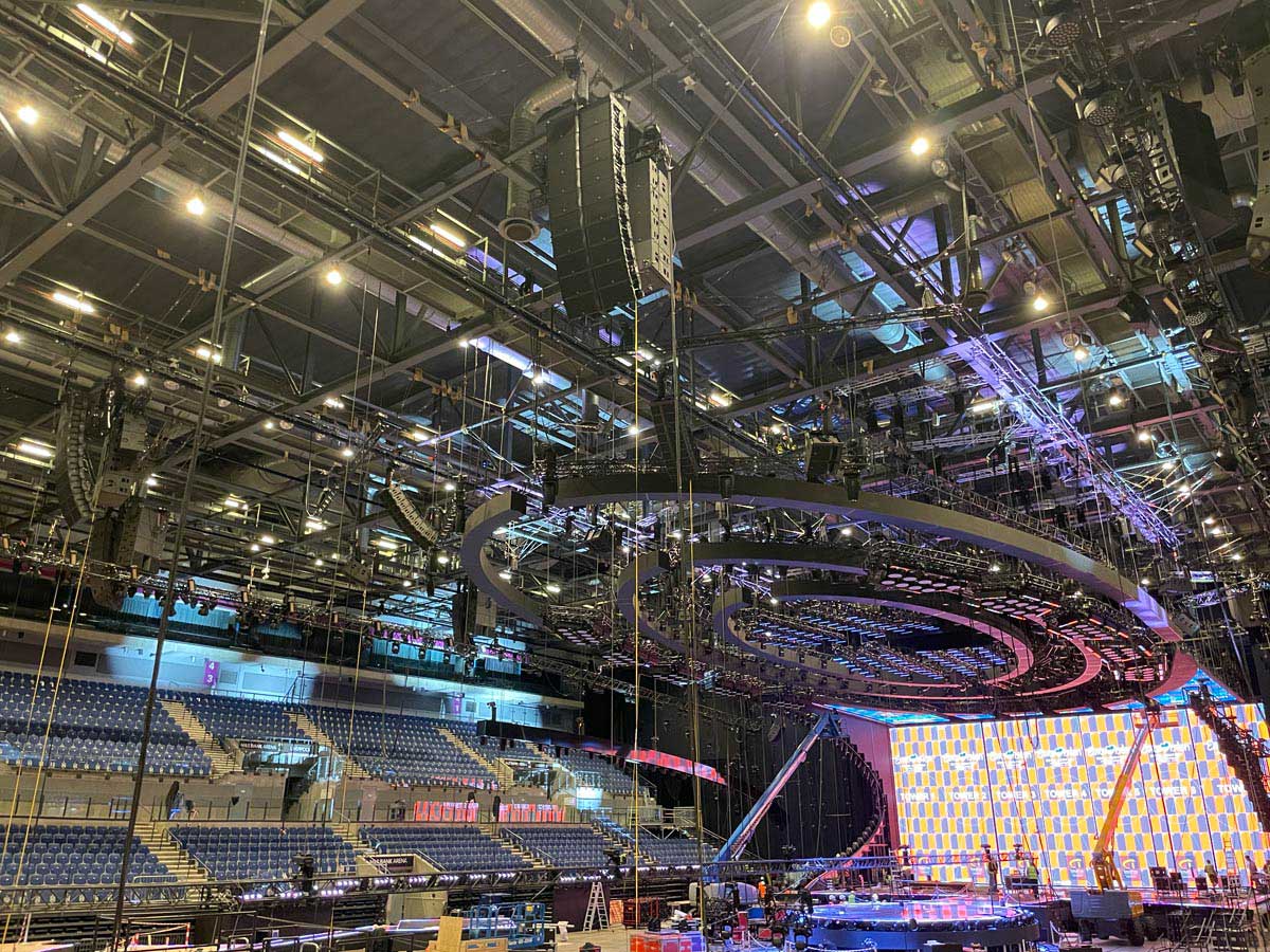 Line array speakers being suspended inside Liverpool Arena