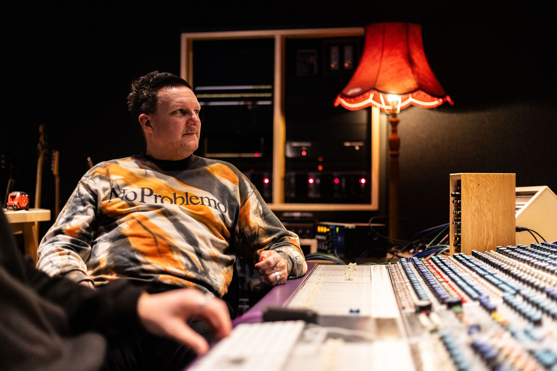 Music Producer Sie Medway-Smith sat at the Neve console (Salvation Studios)