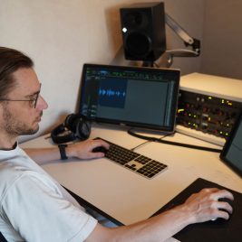Recording engineer Tommi Schneefuss at his studio desk