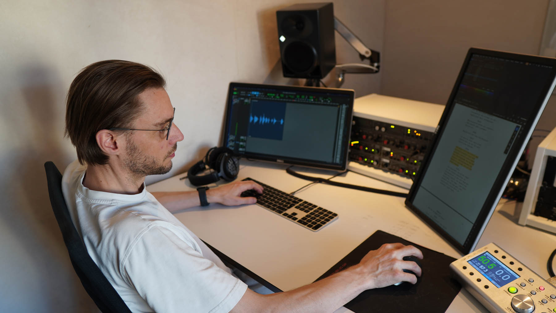 Recording engineer Tommi Schneefuss at his studio desk