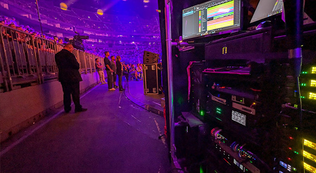 Live music stadium crowd with playback rig on right-hand side