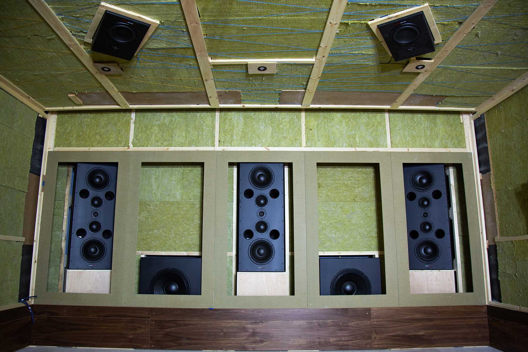 Dynaudio M-Series monitors being installed behind the screens at Sound Disposition