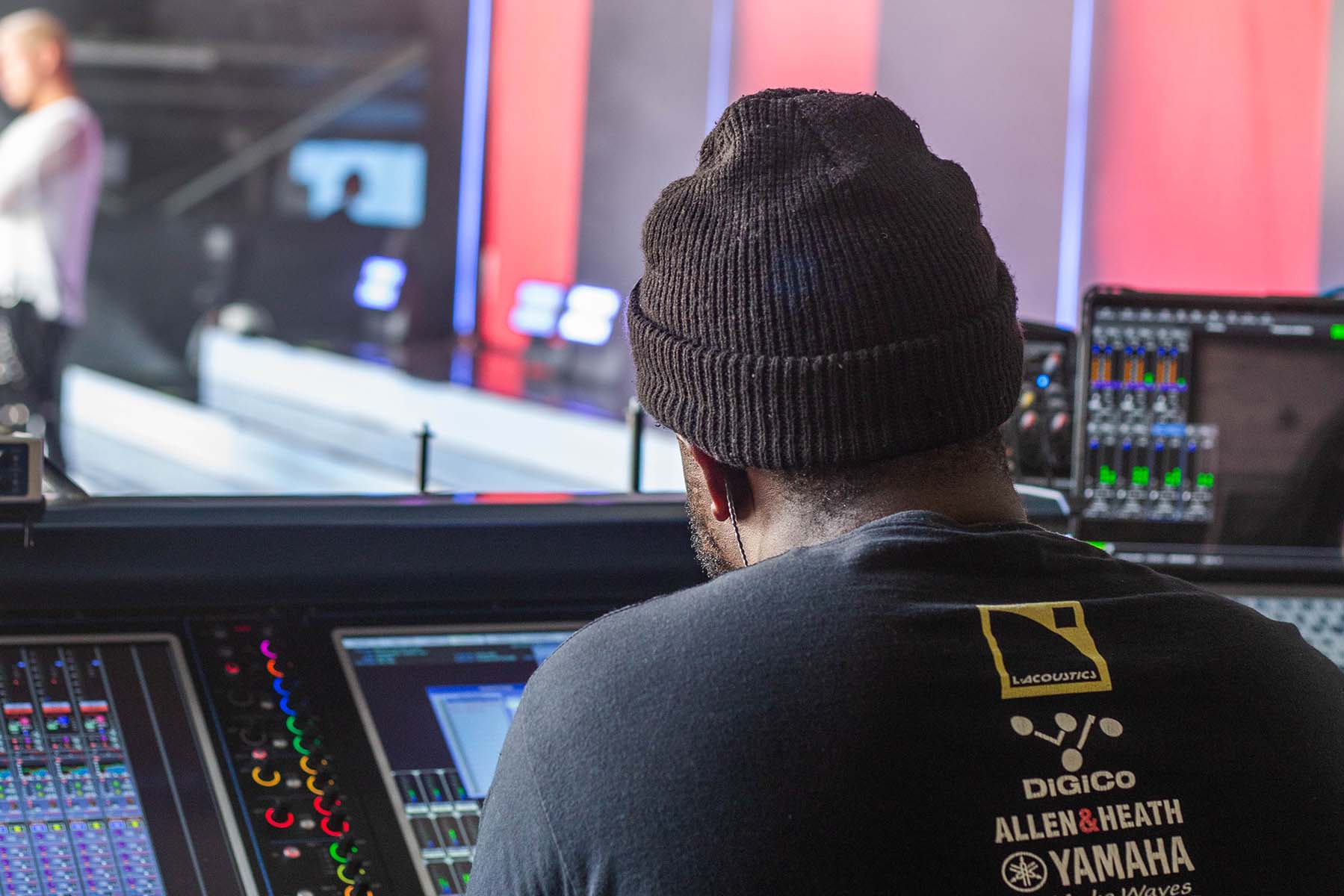 Behind shot of Fabrice Lemeul at his monitors mixing desk