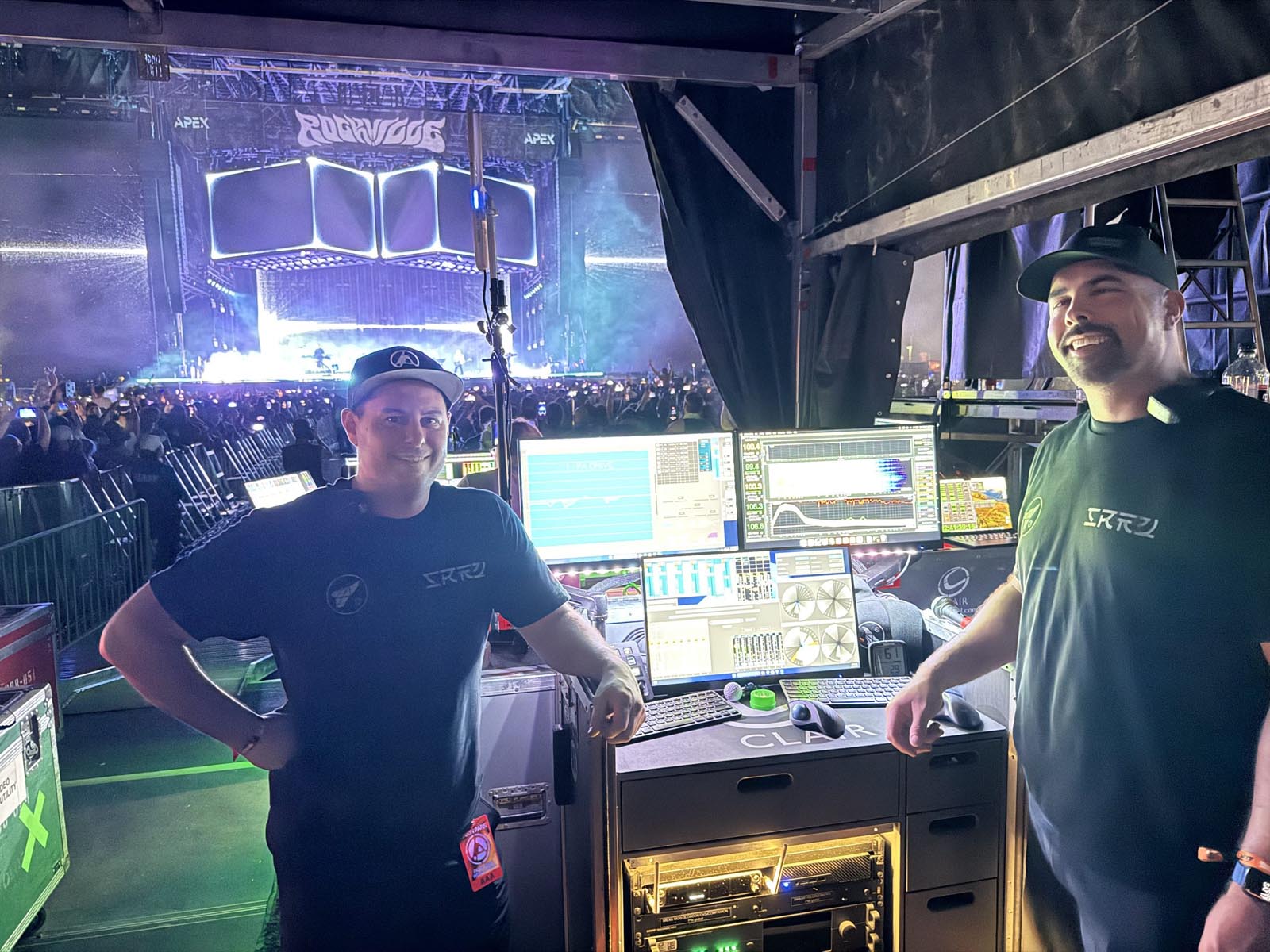 Live sound engineers Ricki Cook and Bill Chase with stage in background