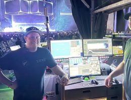 Live sound engineers Ricki Cook and Bill Chase with stage in background