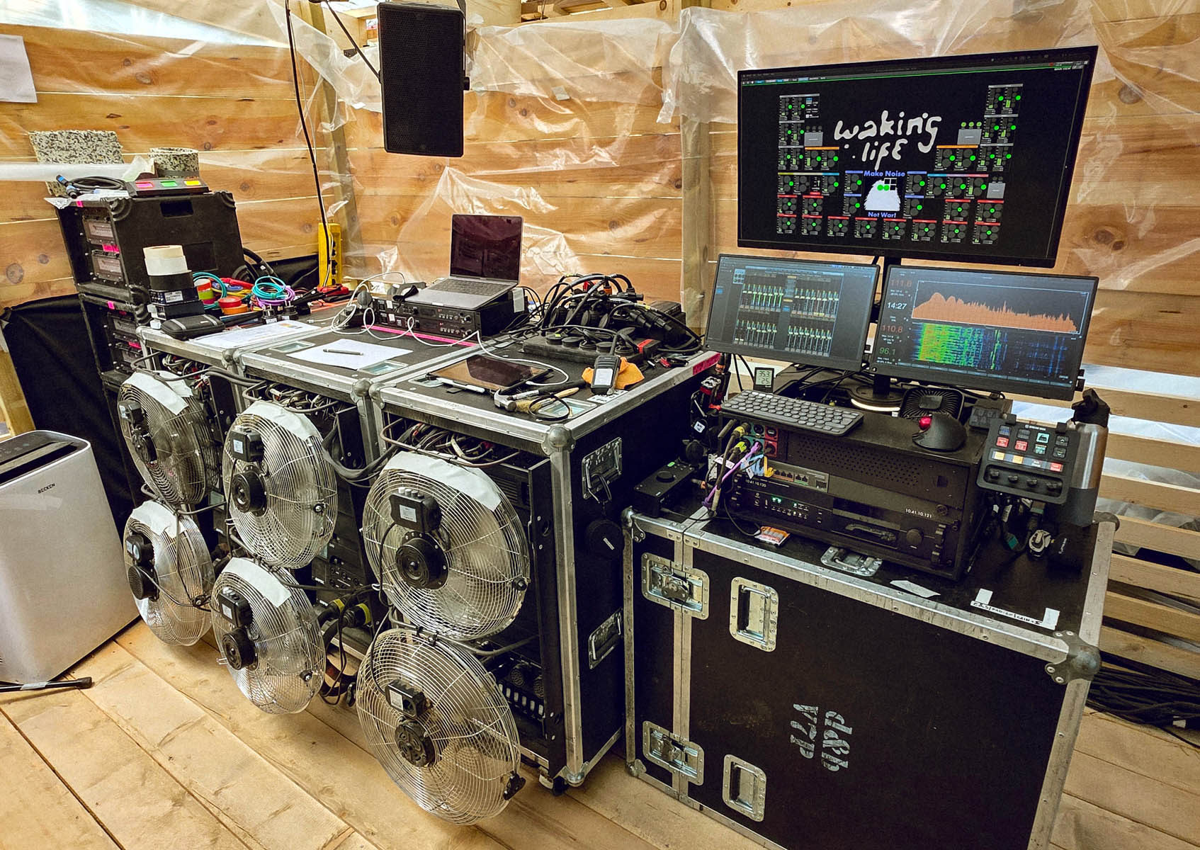 Backstage at the Outro Lado stage, showing one of the two PRODIGY.MP rigs alongside the PA and DJ monitor amplifiers. Credit Nando