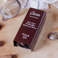 Tierra Audio Flavours Cocoa inline preamp on chopping board with cocoa powder