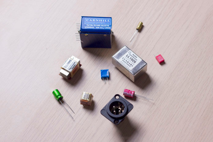 Assorted electronic components on a wooden surface