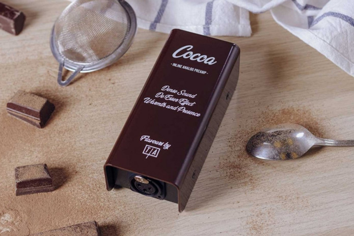 Tierra Audio Flavours Cocoa inline preamp on chopping board with cocoa powder