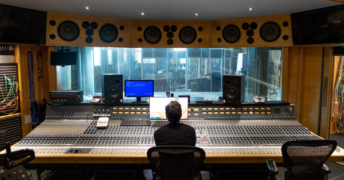 Mix engineer in front of console at Air Studios